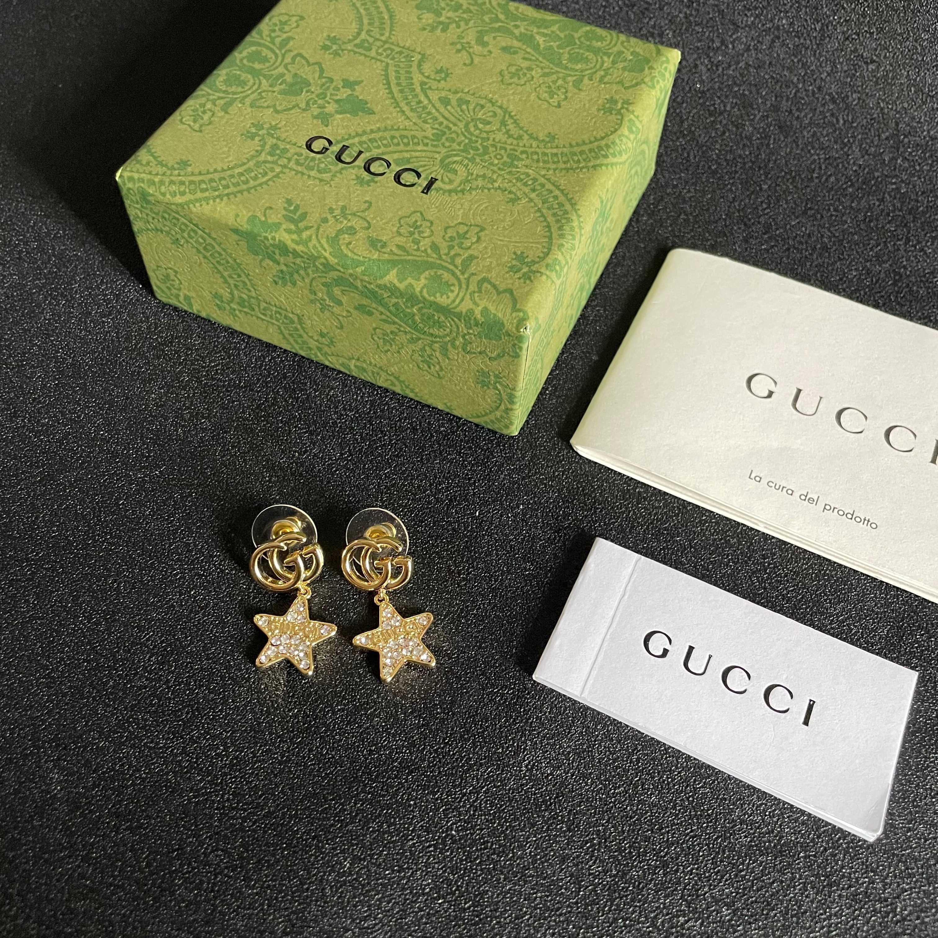 GUCCI 26S DOUBLE G STAR CRYSTAL DROP EARRINGS IN GOLD TONE METAL 627015