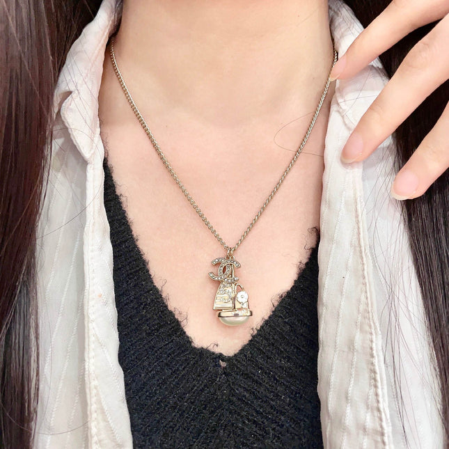 CHANEL 26S DOUBLE C LOGO SAILBOAT PENDANT NECKLACE WITH PEARL IN GOLD METAL 630060