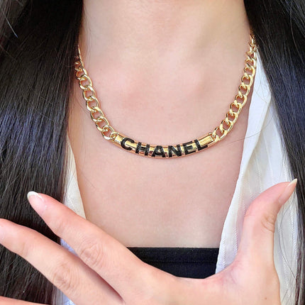 CHANEL 26S CHANEL BLACK LETTER LOGO CHAIN NECKLACE IN GOLD METAL 630061
