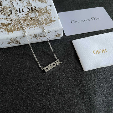 CD 26S PAVE LOGO LETTER NECKLACE IN SILVER TONE METAL 631805