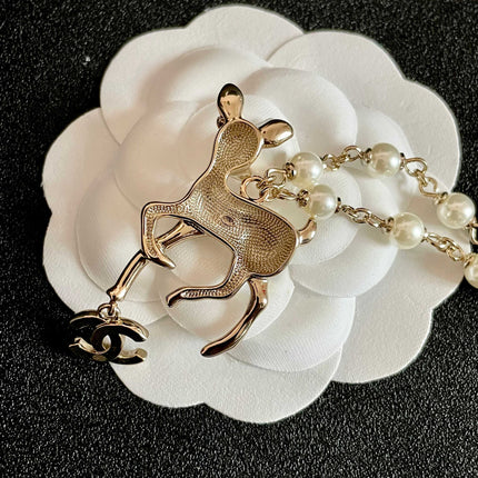 CHANEL 26S DOUBLE C LOGO FAWN CHARM NECKLACE WITH PEARL CHAIN IN GOLD METAL 633292