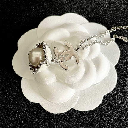CHANEL 26S DOUBLE C LOGO PEARL DROP PENDANT NECKLACE WITH CRYSTAL HALO IN SILVER METAL 633293
