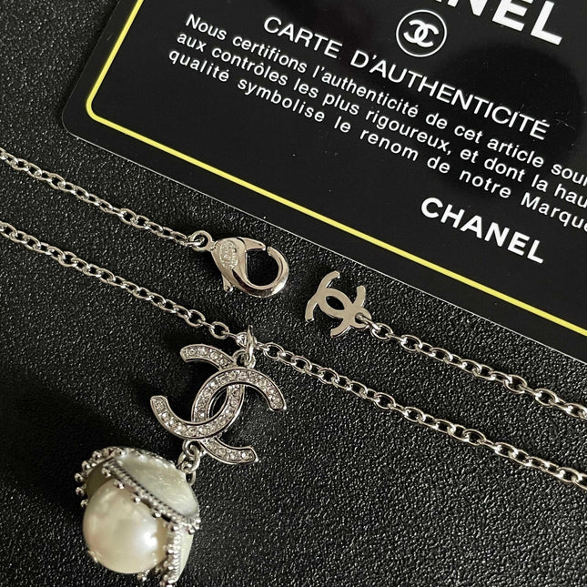 CHANEL 26S DOUBLE C LOGO PEARL DROP PENDANT NECKLACE WITH CRYSTAL HALO IN SILVER METAL 633293
