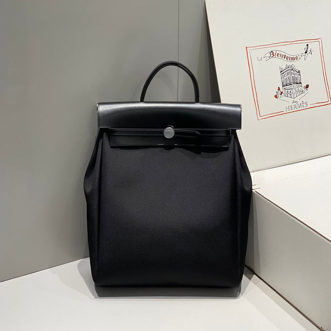 HERBAG A DOS ZIP RETOURNE BACKPACK 29 IN BLACK CANVAS AND CALFSKIN
