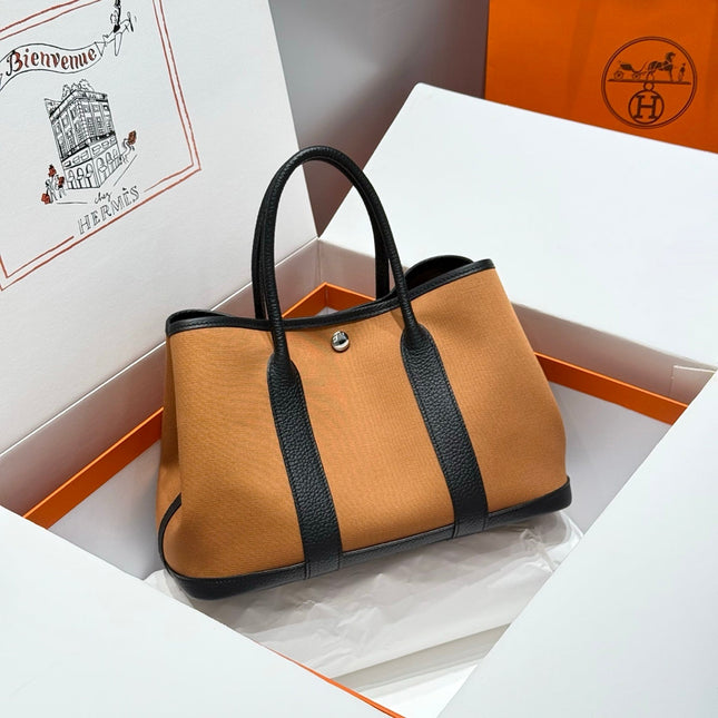 GARDEN PARTY 30CM IN ORANGE MINIMUM TOILETS COTTON CANVAS AND BLACK CALFSKIN