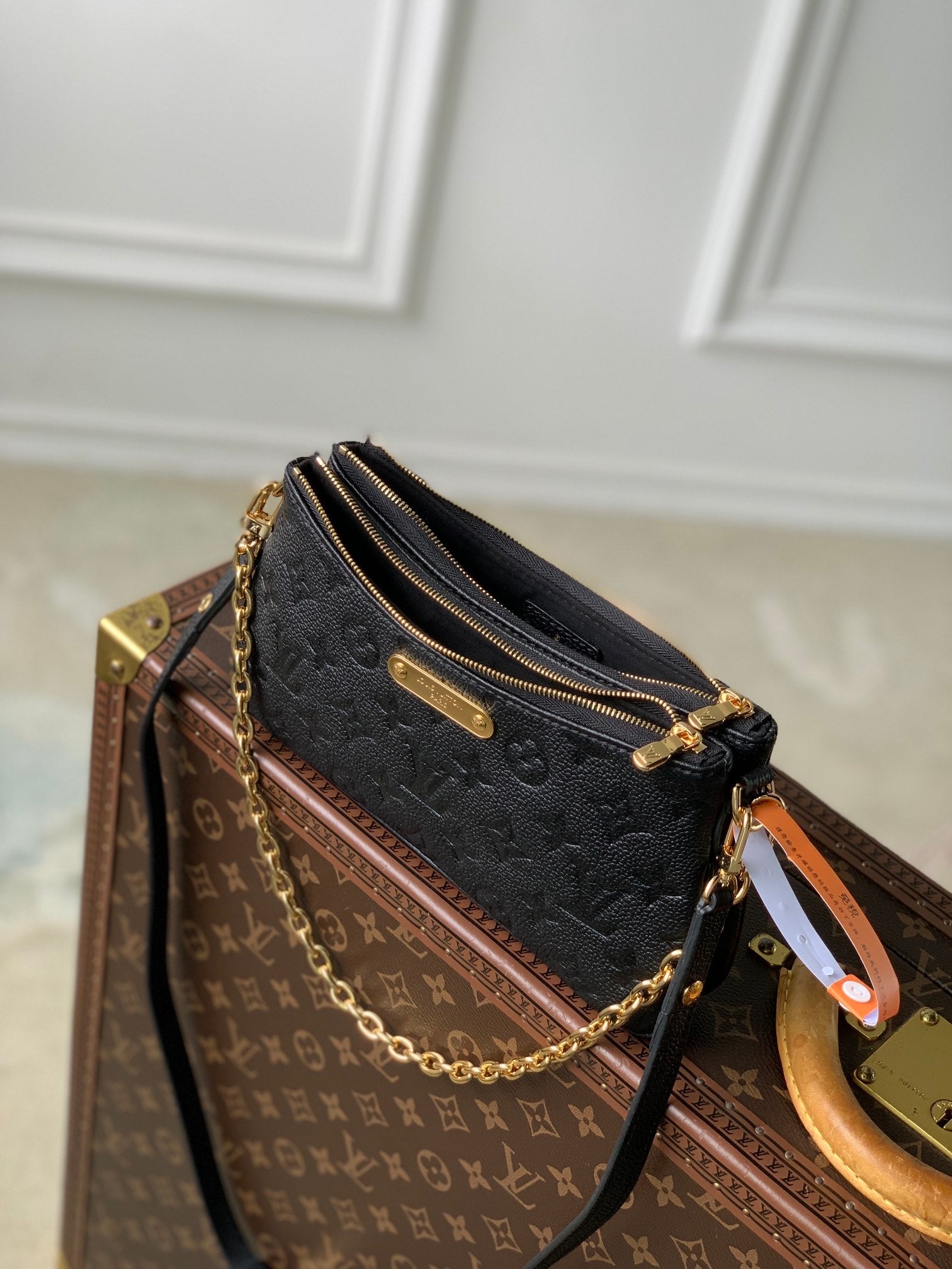 LIV POCHETTE BAG 24 IN BLACK MONOGRAM EMPREINTE LEATHER