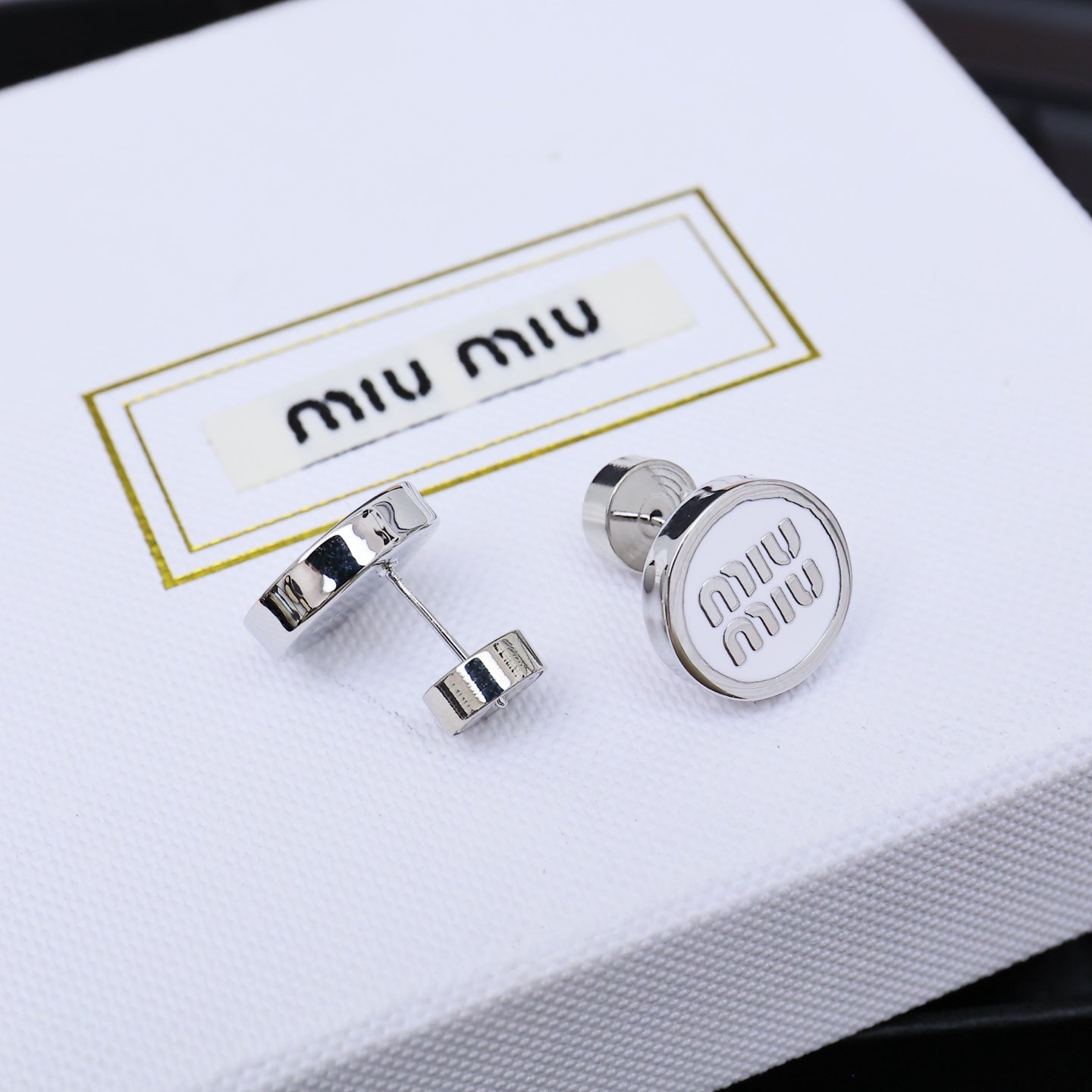 MIUMIU 26S ROUND LOGO STUD EARRINGS IN WHITE ENAMEL AND SILVER TONE METAL 625609