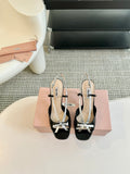 Black High Heels With Silver Bow