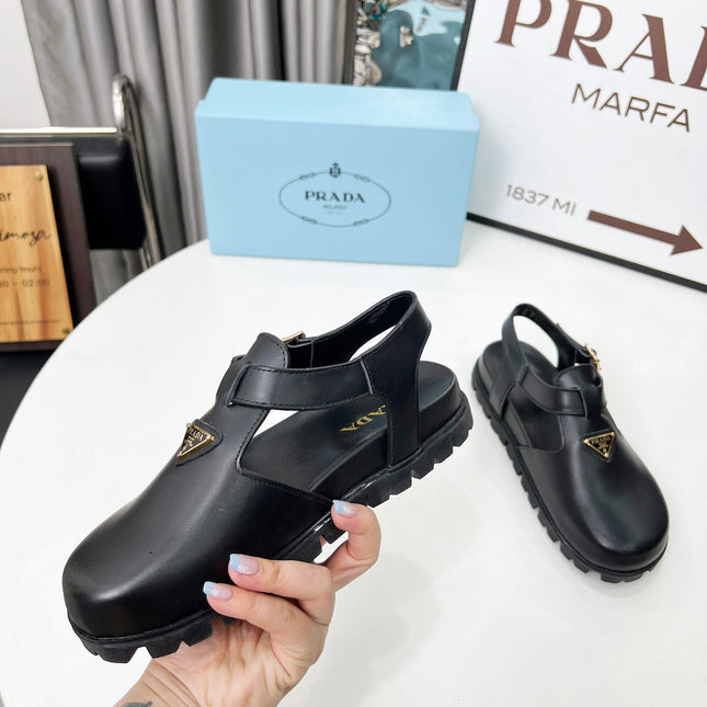 PRADA 26S RUBBER LOGO CHUNKY SOLE FISHERMAN SANDALS IN BLACK CALFSKIN