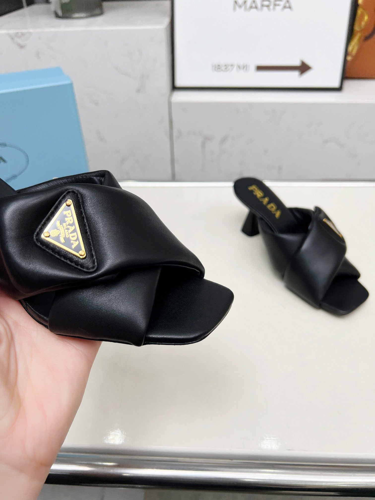PRA CROSS MULE HEELS IN BLACK CALFSKIN WITH PADDED STRAPS