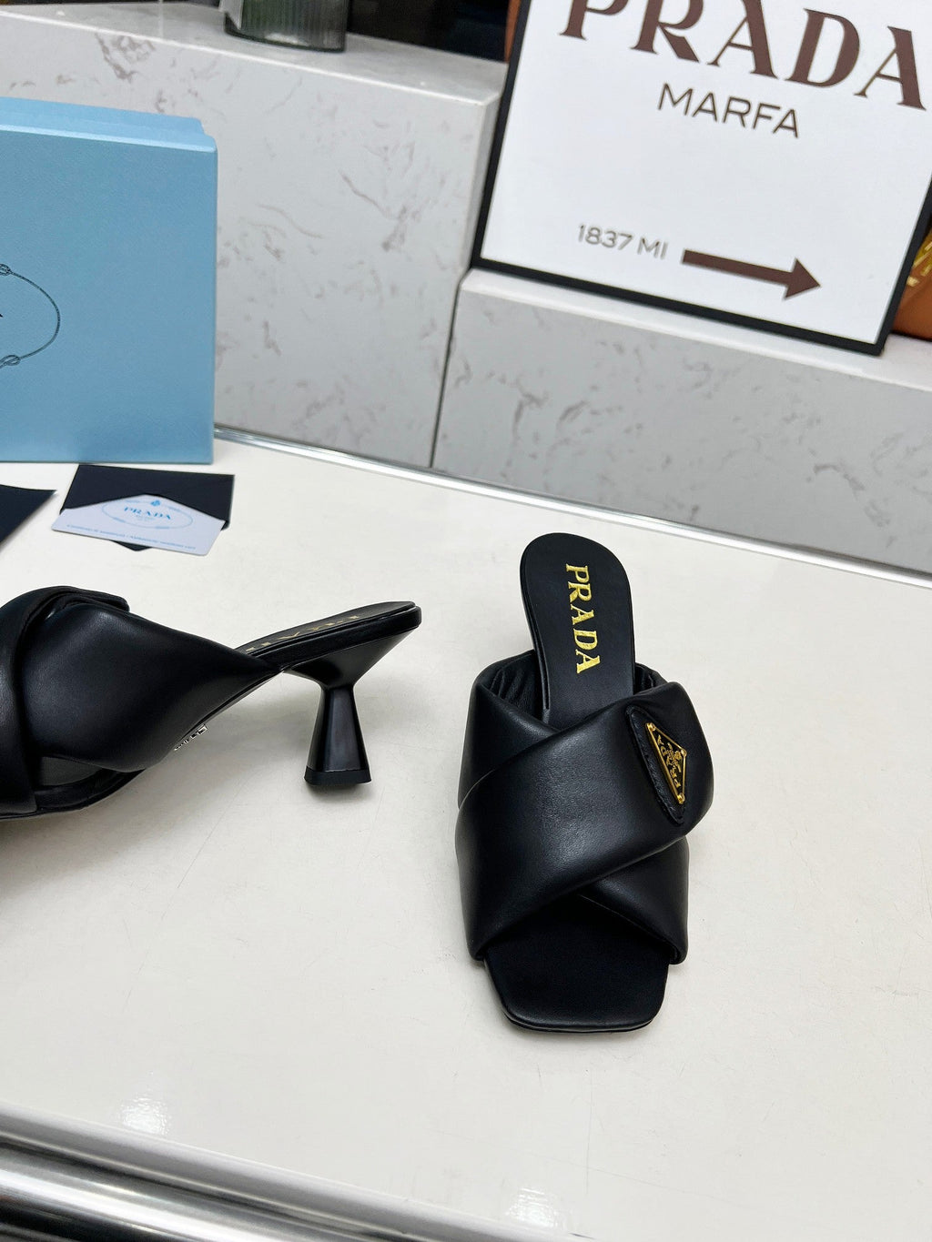 PRA CROSS MULE HEELS IN BLACK CALFSKIN WITH PADDED STRAPS