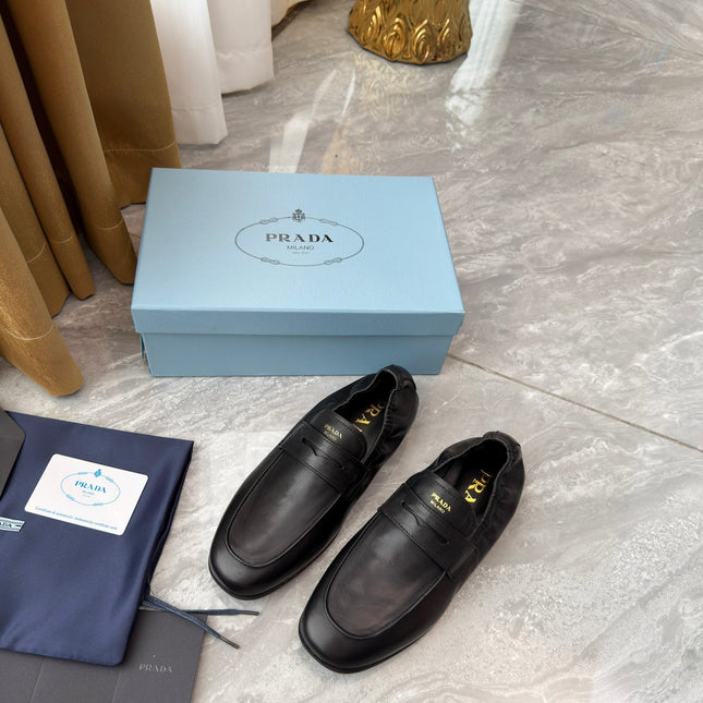 PRADA 25S LOAFERS IN BLACK CALFSKIN