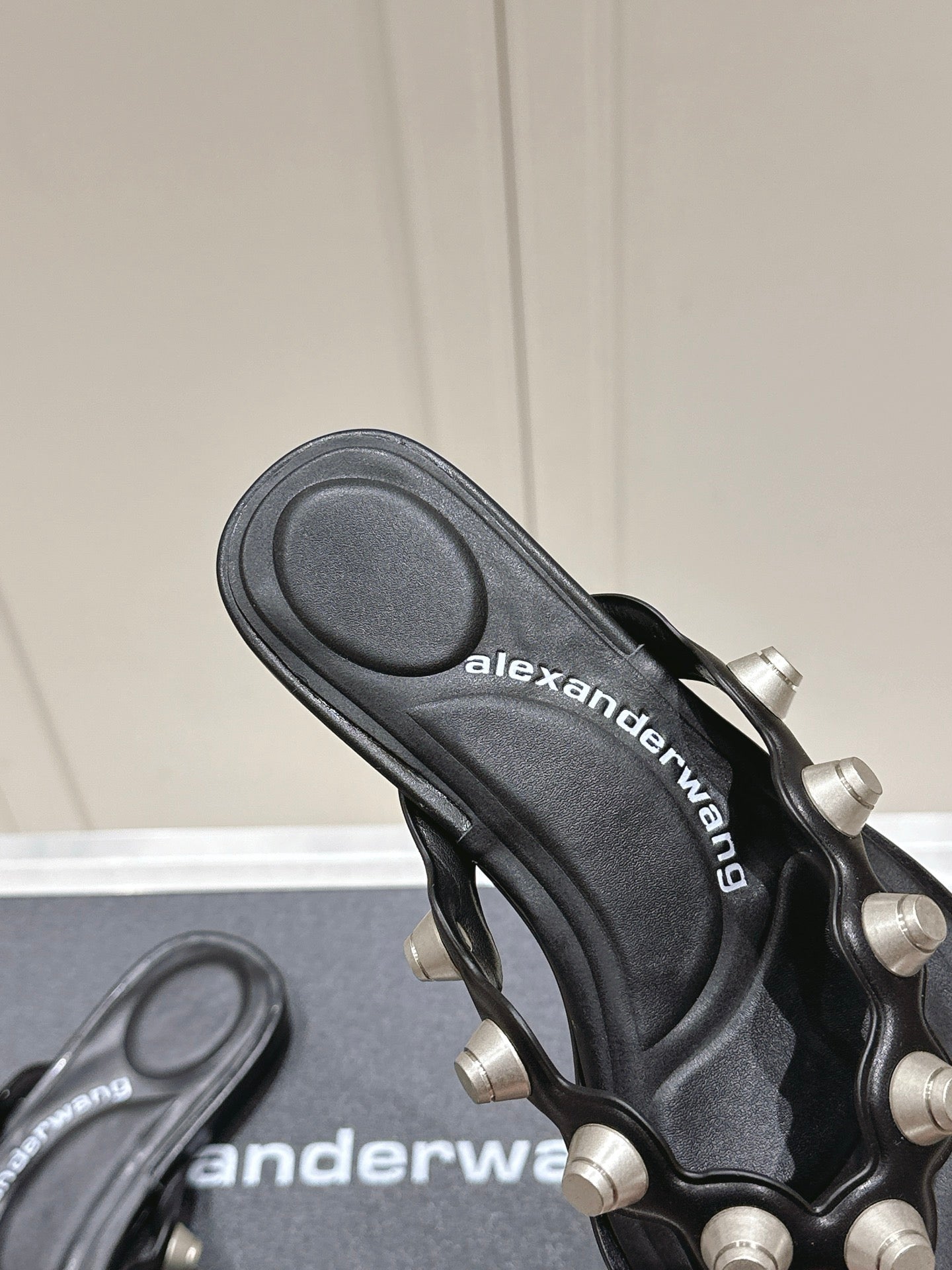 RHODES STUDDED THONG SANDALS IN BLACK CALFSKIN
