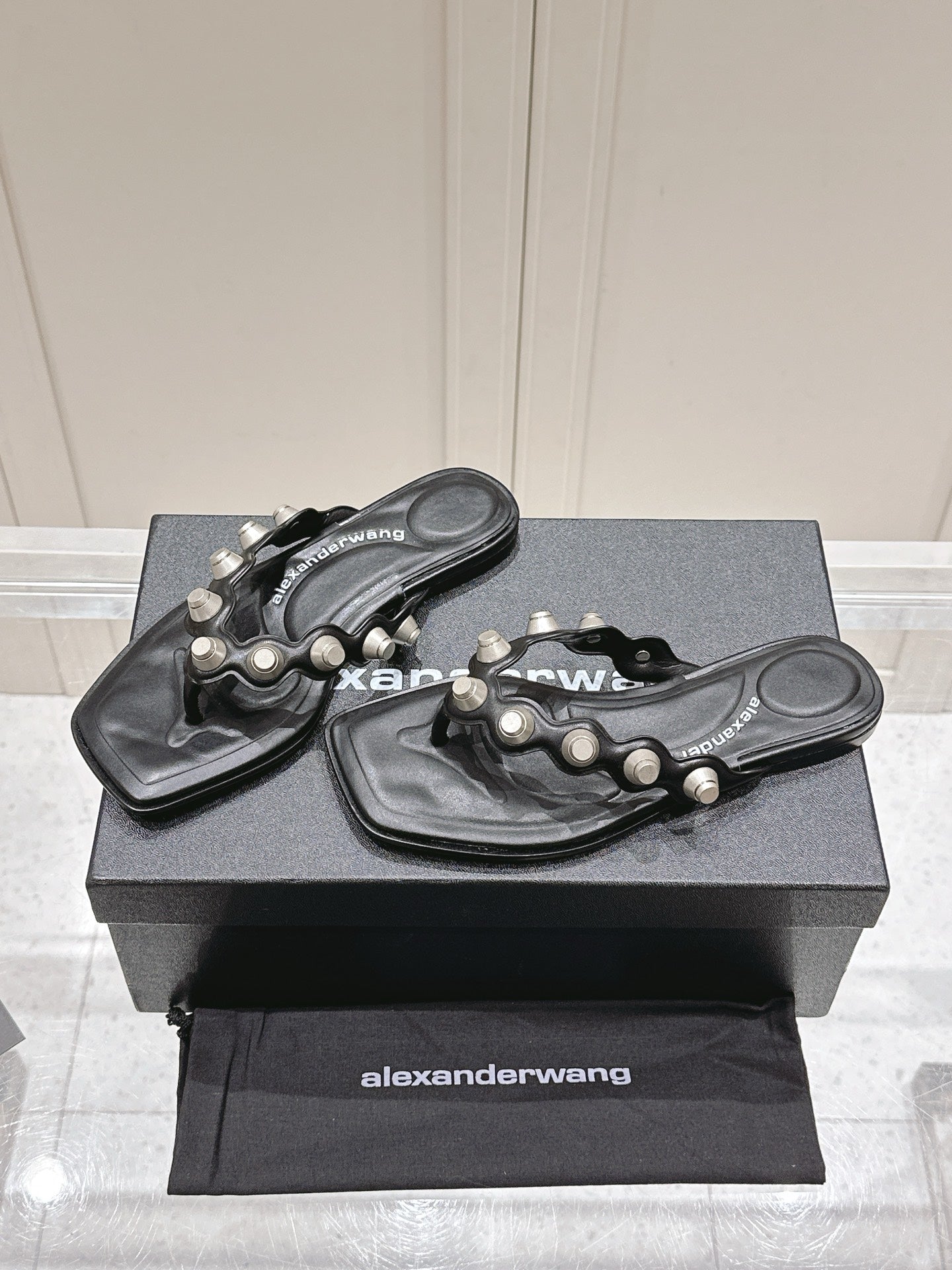 RHODES STUDDED THONG SANDALS IN BLACK CALFSKIN
