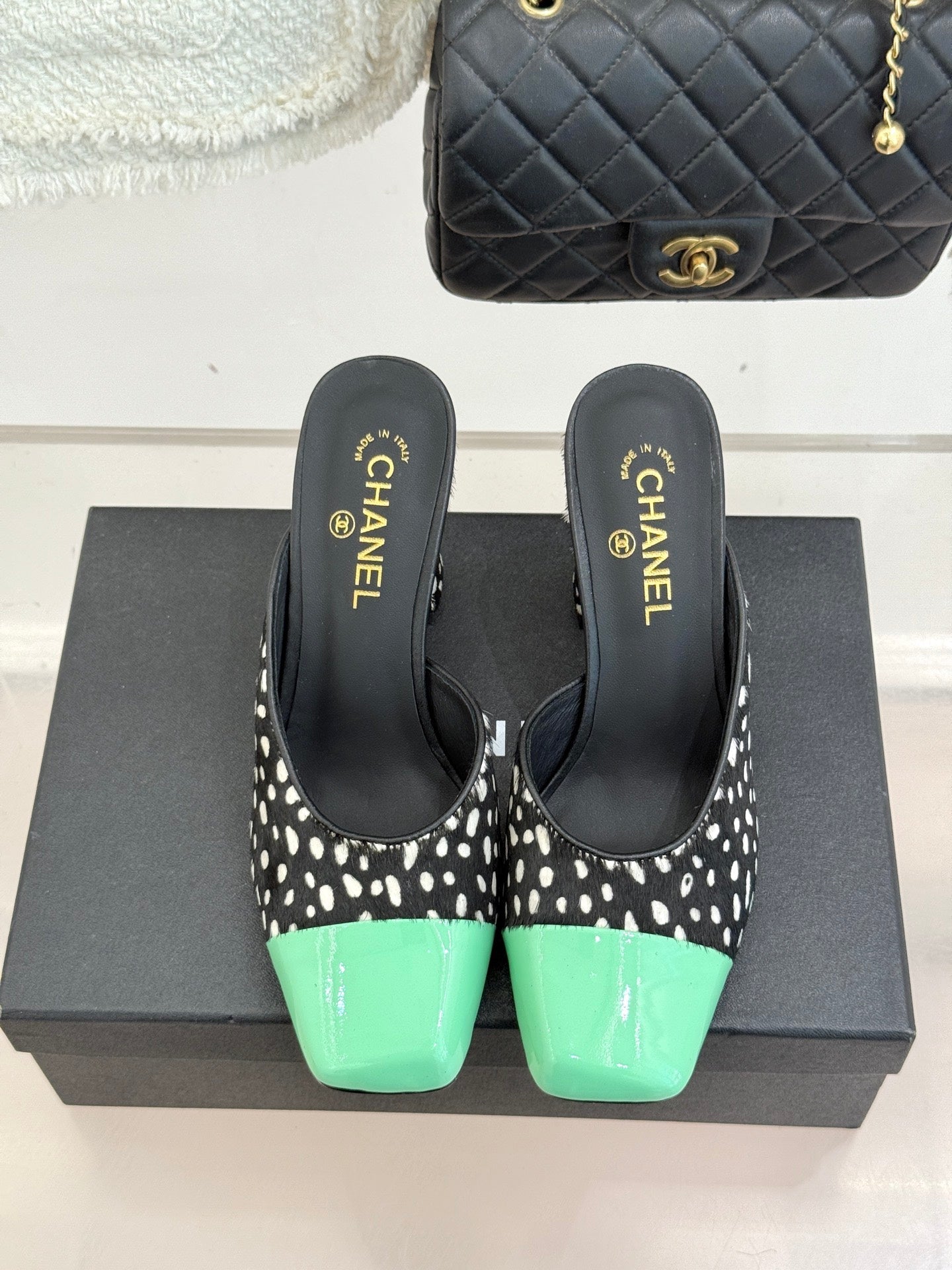 CHANEL POLKA DOT PATTERN MULES IN BLACK MIX GREEN FUR