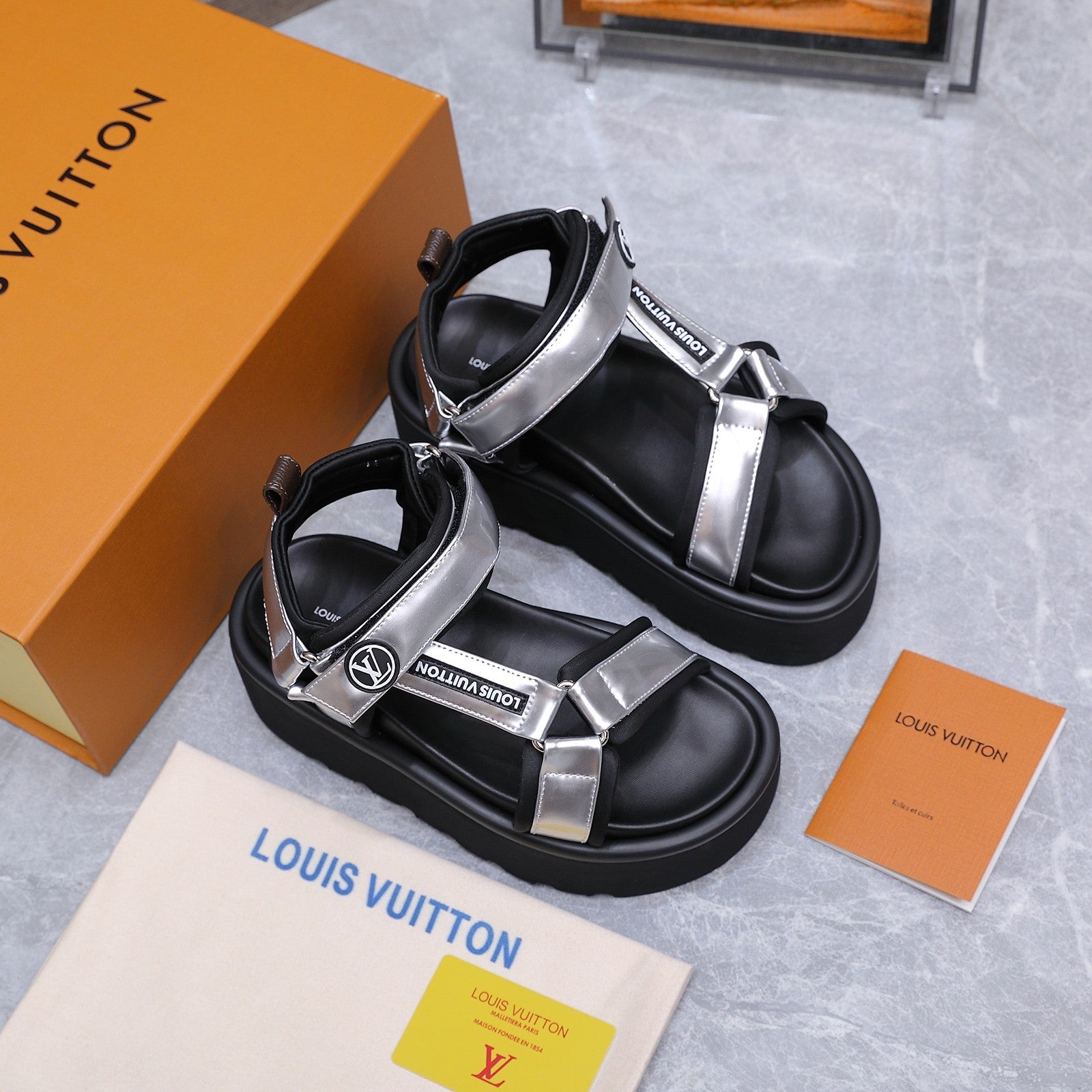 LV 26S CHAMELEON PLATFORM SANDALS 60MM IN SILVER AND BLACK CALFSKIN AND EVA