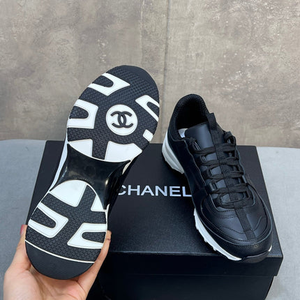 CHANEL 26S RUNNER CC LOGO SNEAKERS IN BLACK CALFSKIN
