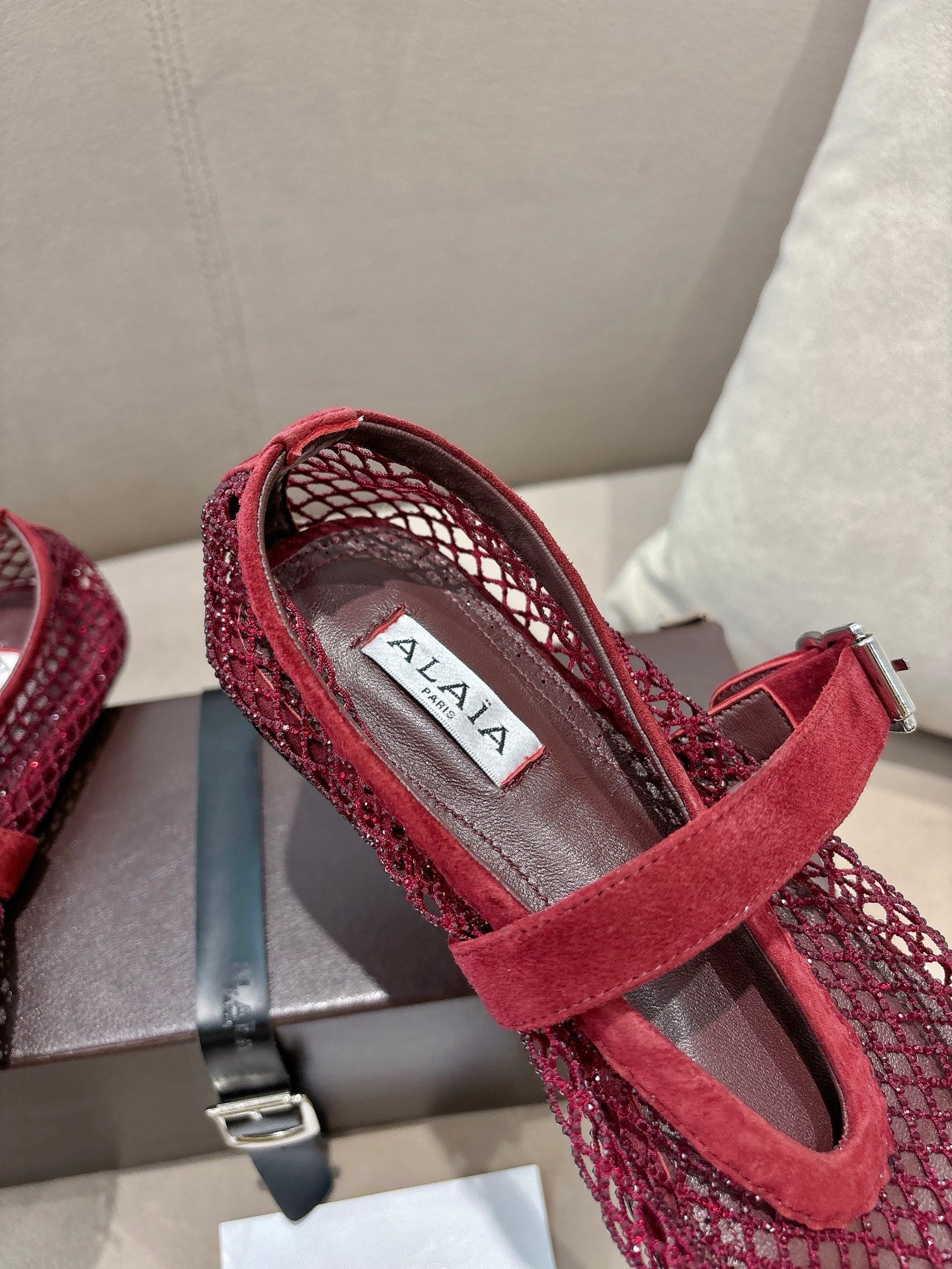 ALAIA 26S MESH FLATS IN DARK RED SUEDE