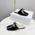 DIOR 26S PEARL-ACCENT BOW FLAT MULES IN BLACK GLOSSY CALFSKIN