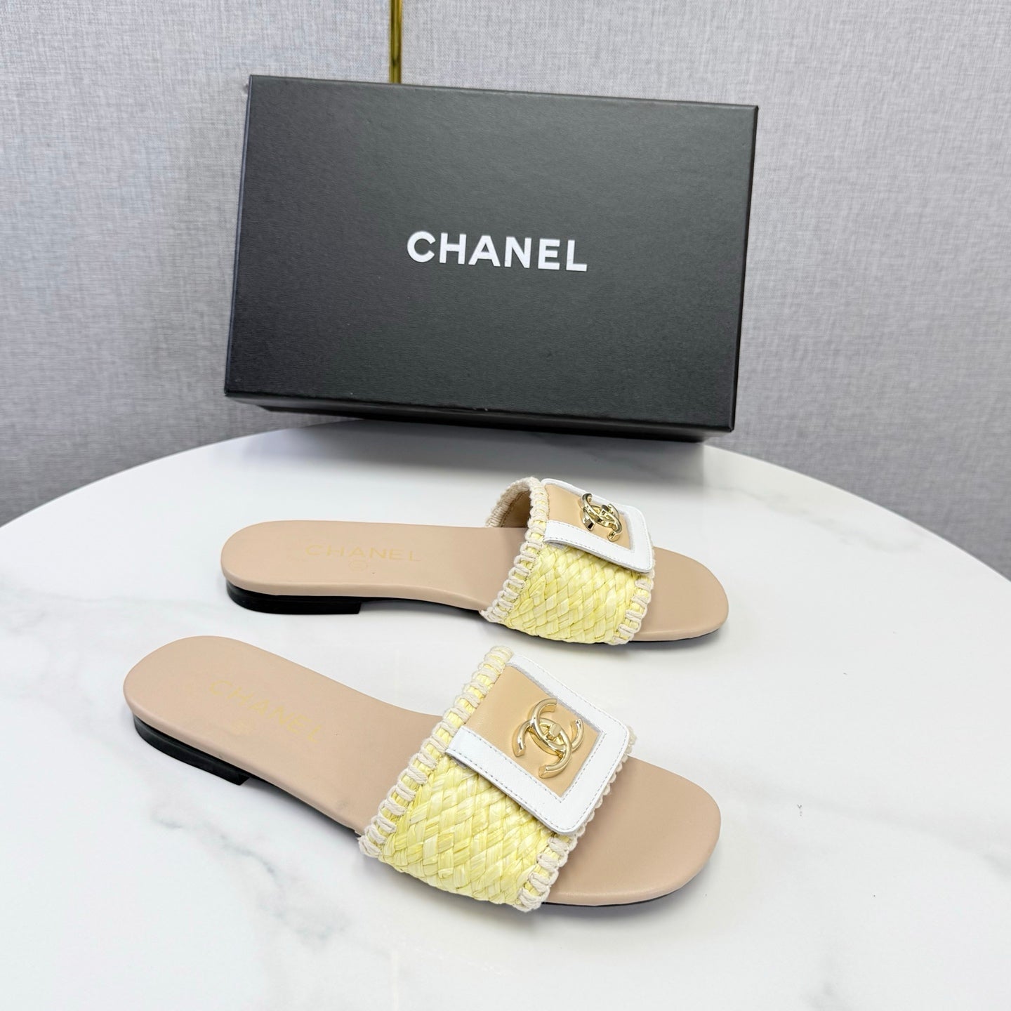 CHANEL 26S WOVEN STRAP SLIDES IN YELLOW AND BEIGE LAMBSKIN