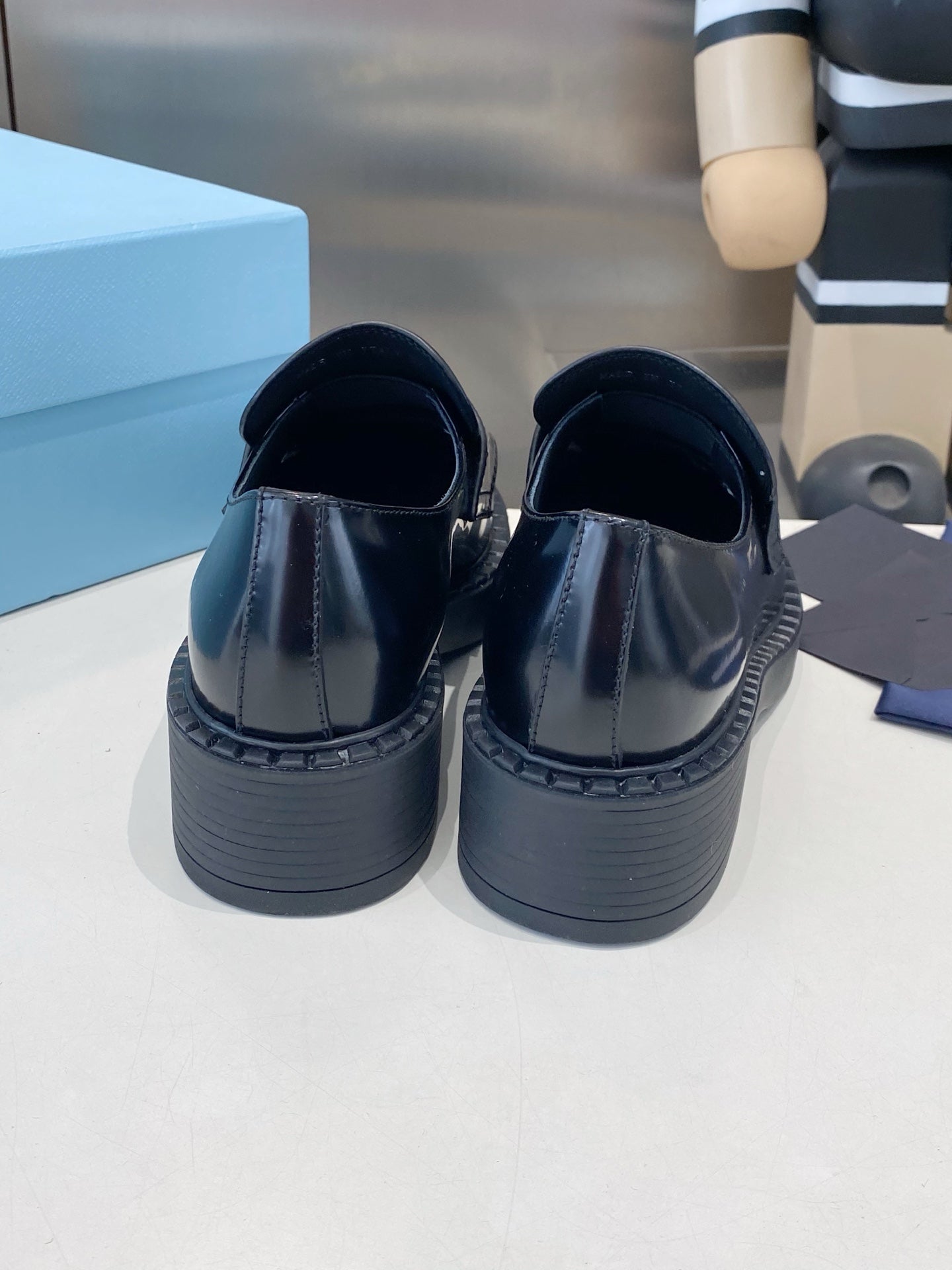 PRADA 26S LOAFERS IN BLACK AND WHITE CALFSKIN WITH LOGO