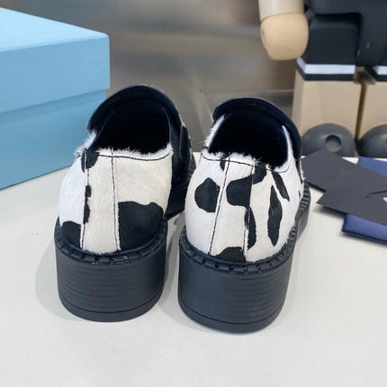 PRADA 26S LOAFERS IN WHITE AND BLACK COW PRINT PONY HAIR