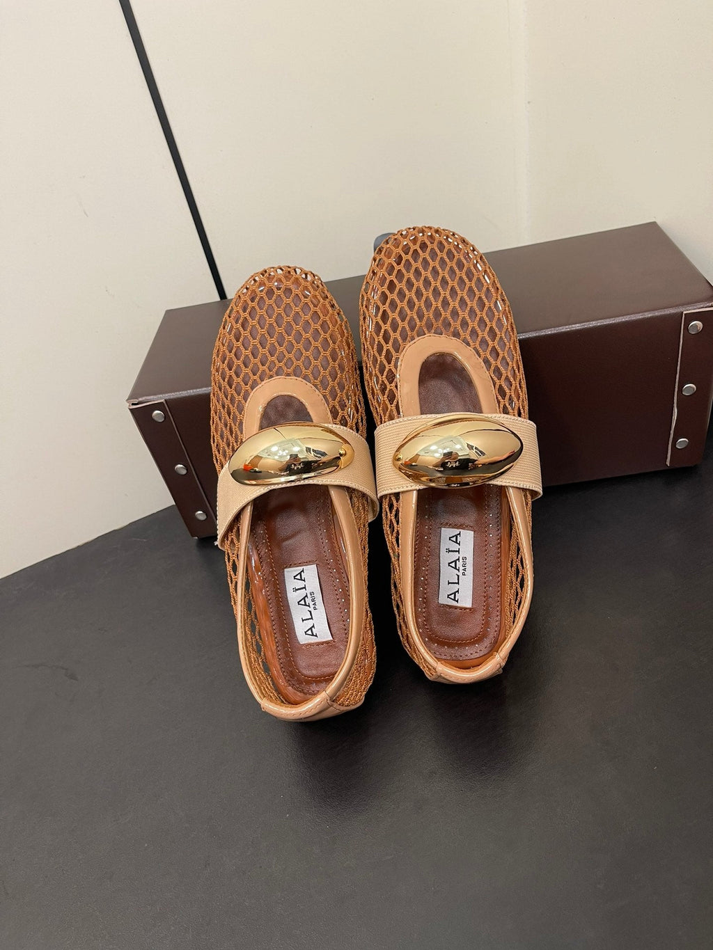 ALAIA BALLET FLATS IN COPPER BROWN MESH FISHNET WITH GOLD HARDWARE