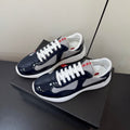 PRADA 26S SNEAKERS IN NAVY BLUE PATENT CALFSKIN AND WHITE MESH