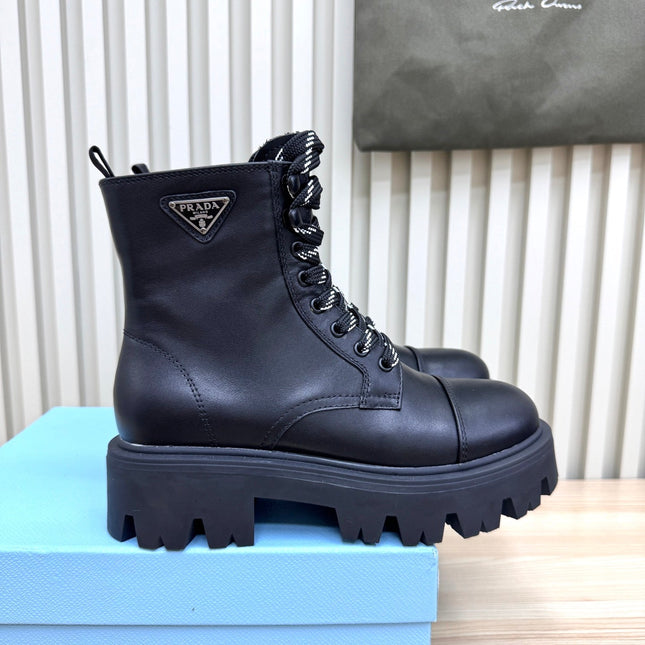 PRADA 25S MONOLITH BOOTS IN BLACK CALFSKIN