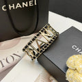 CHANEL 26S CHANEL LOGO OPEN CUFF LEATHER CHAIN BRACELET IN GOLD METAL 630836