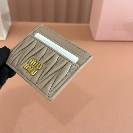MM MATELASSÉ CARD HOLDER 10.5 IN BEIGE CALFSKIN