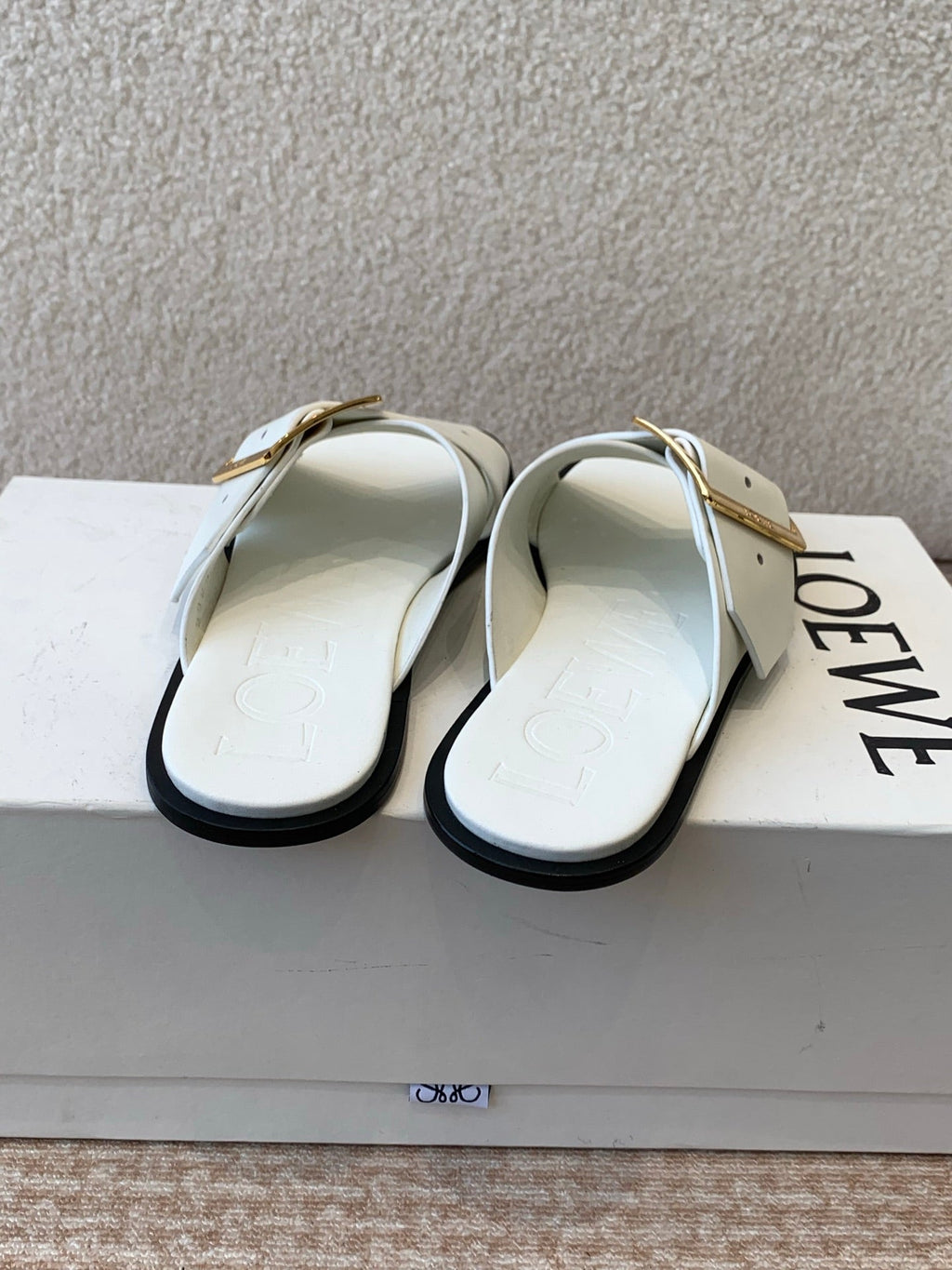 PETAL BELT FLAT SANDAL IN WHITE CALFSKIN