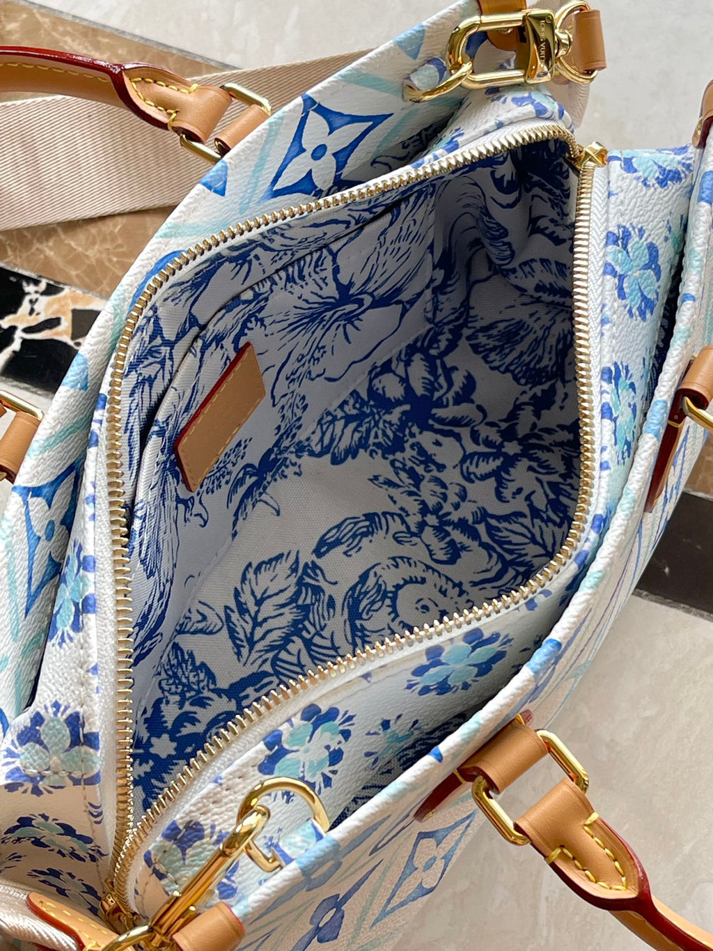 ONTHEGO EAST WEST 25 IN LAGOON BLUE MONOGRAM TILES CANVAS