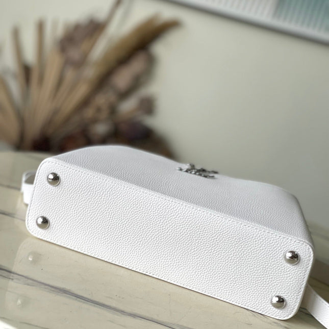 CAPUCINES EAST-WEST 33 IN WHITE CALFSKIN SILVER HARDWARE