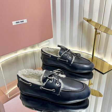 MIUMIU 26S FUR BOAT SHOES IN BLACK CALFSKIN