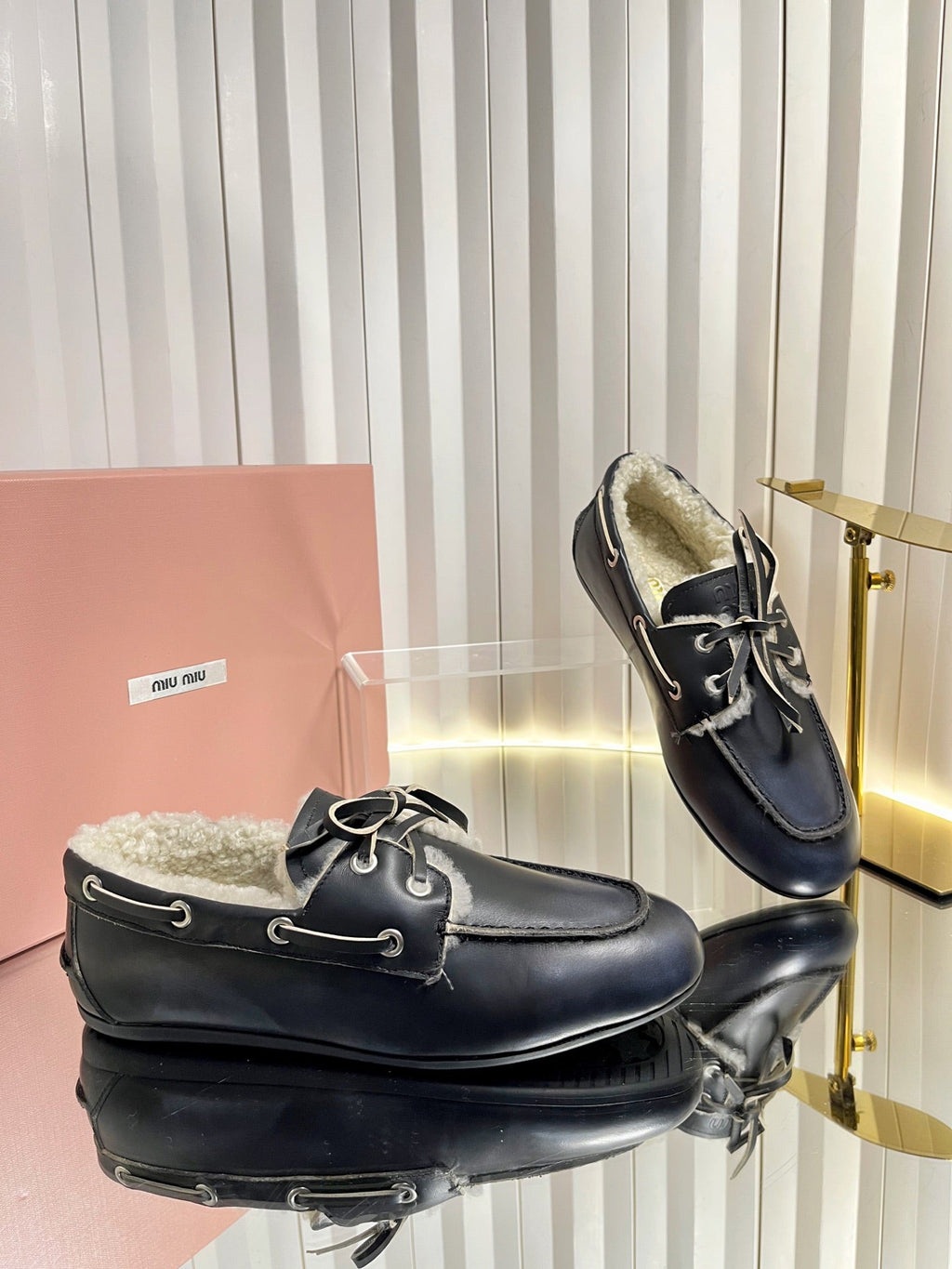 MIUMIU 26S FUR BOAT SHOES IN BLACK CALFSKIN