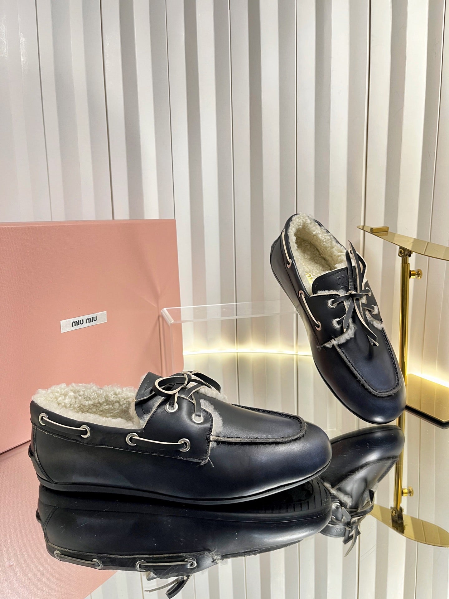 MIUMIU 26S FUR BOAT SHOES IN BLACK CALFSKIN