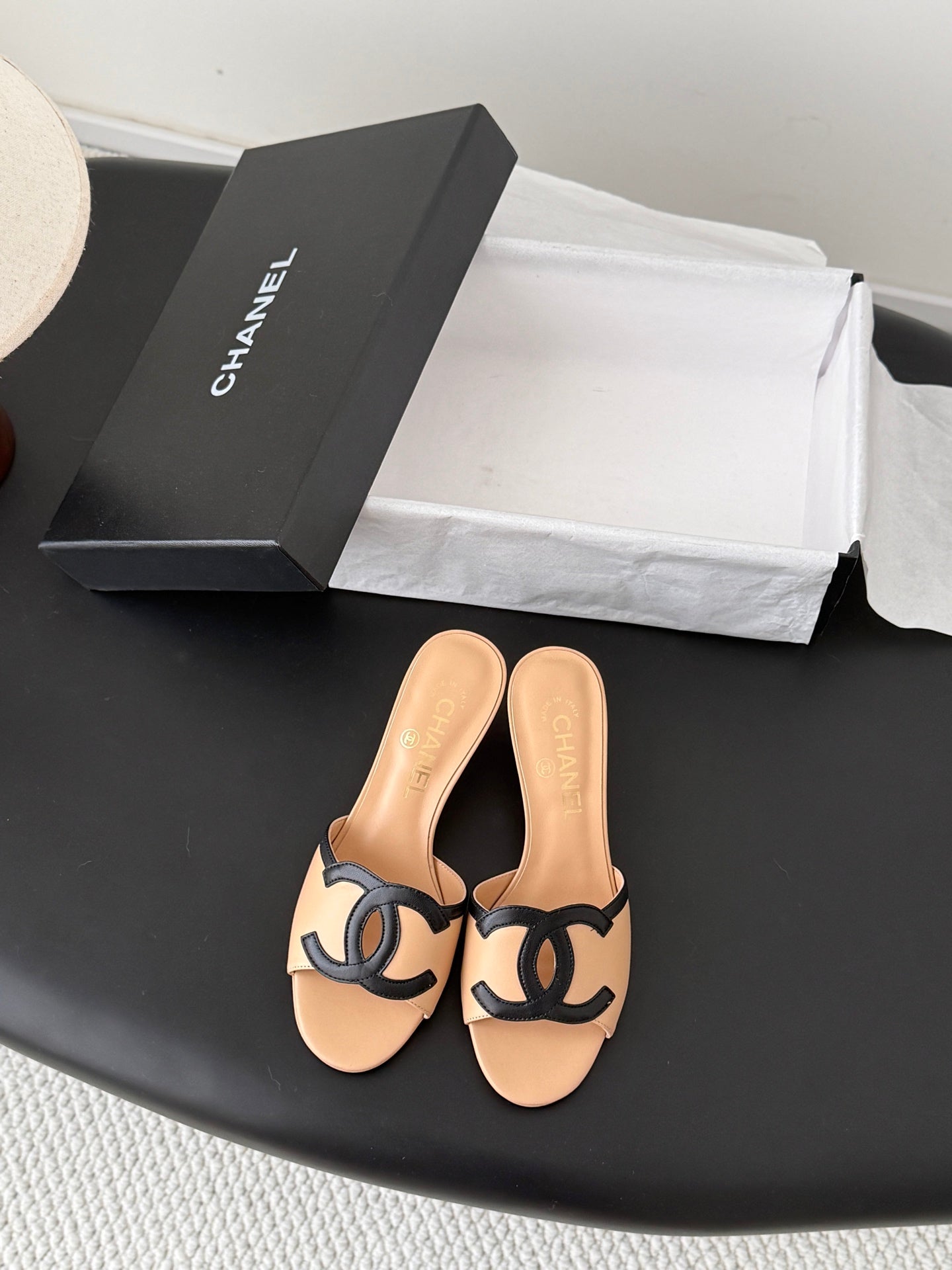 CHANEL MULES IN BEIGE AND BLACK CALFSKIN