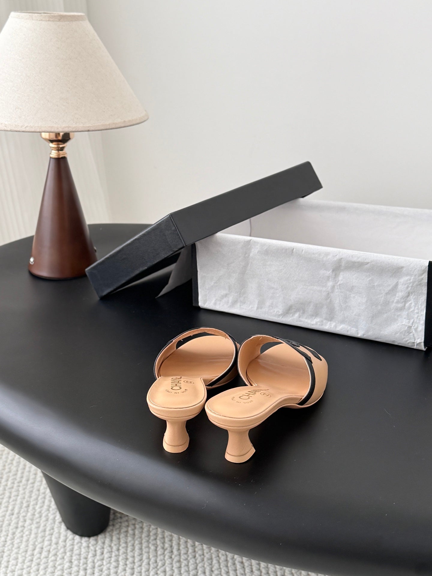 CHANEL MULES IN BEIGE AND BLACK CALFSKIN