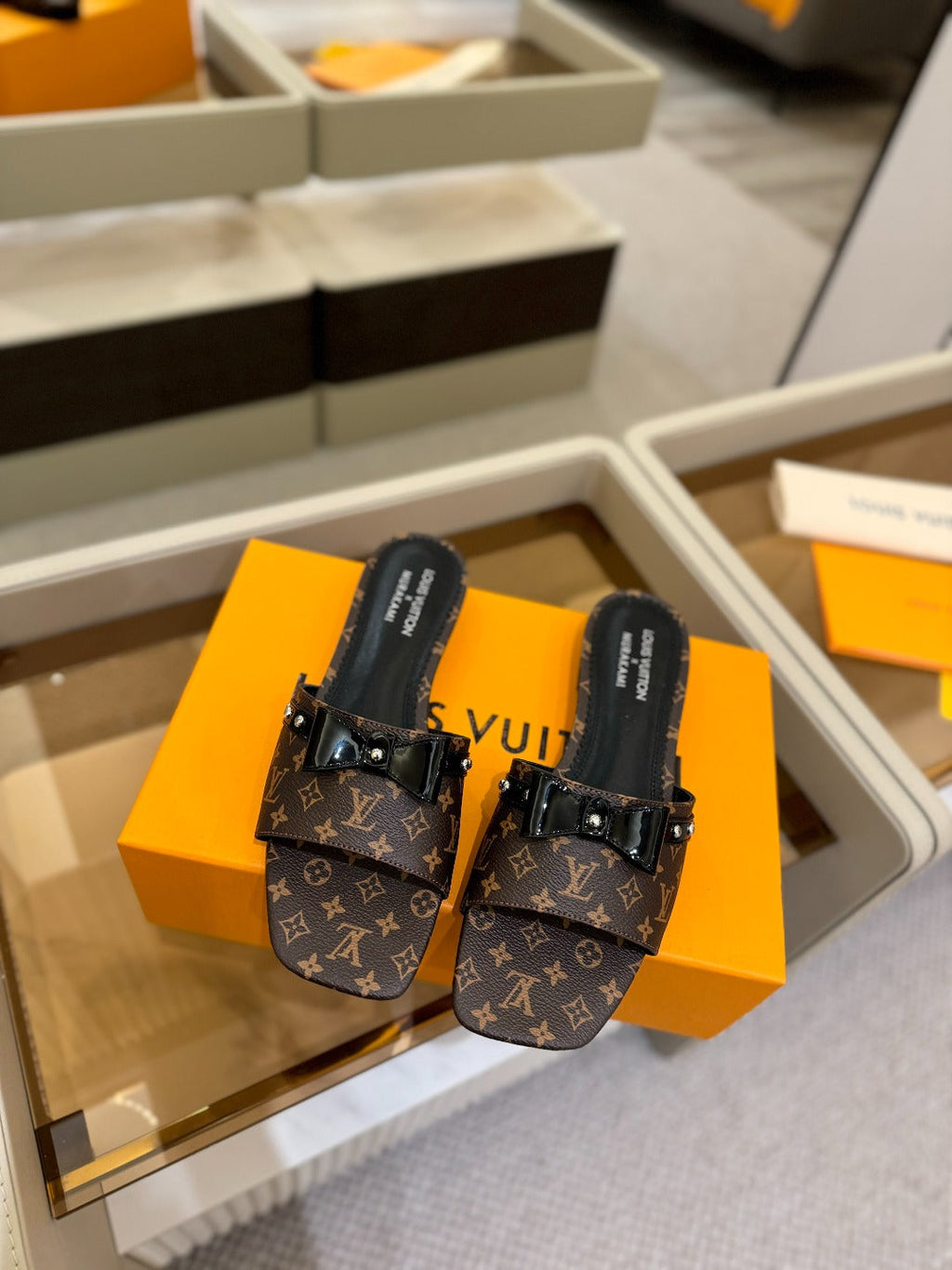 LV X TM 6AM FLAT MULE IN CHOCOLATE BROWN MONOGRAM CALFSKIN