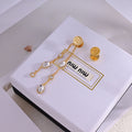 MIUMIU 26S CRYSTAL CHAIN DROP EARRINGS IN GOLD TONE METAL 633263