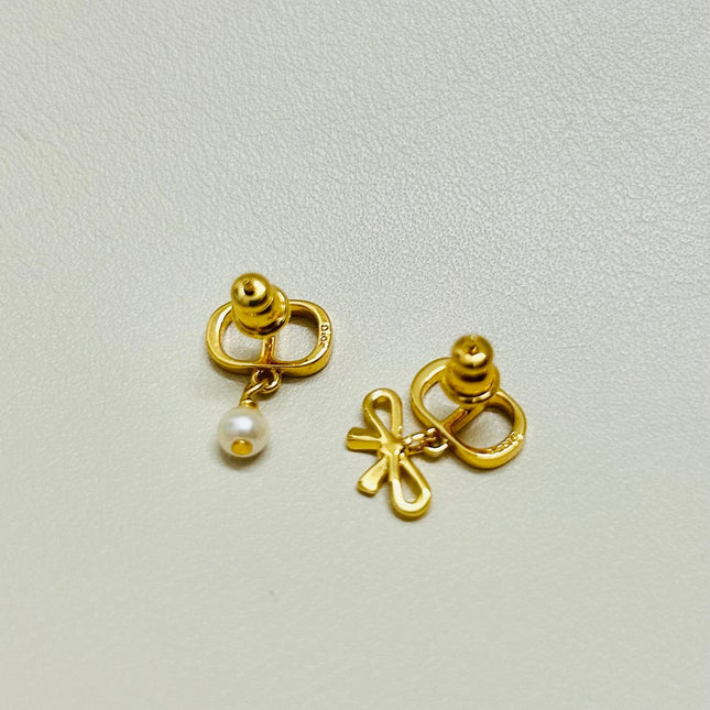 CD 26S MINI BOW PEARL DROP EARRINGS IN GOLD TONE METAL 646612