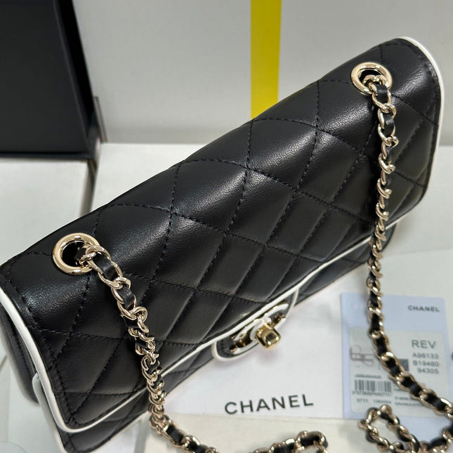 QUILTED FLAP BAG WITH WHITE TRIM 19 IN BLACK LAMBSKIN
