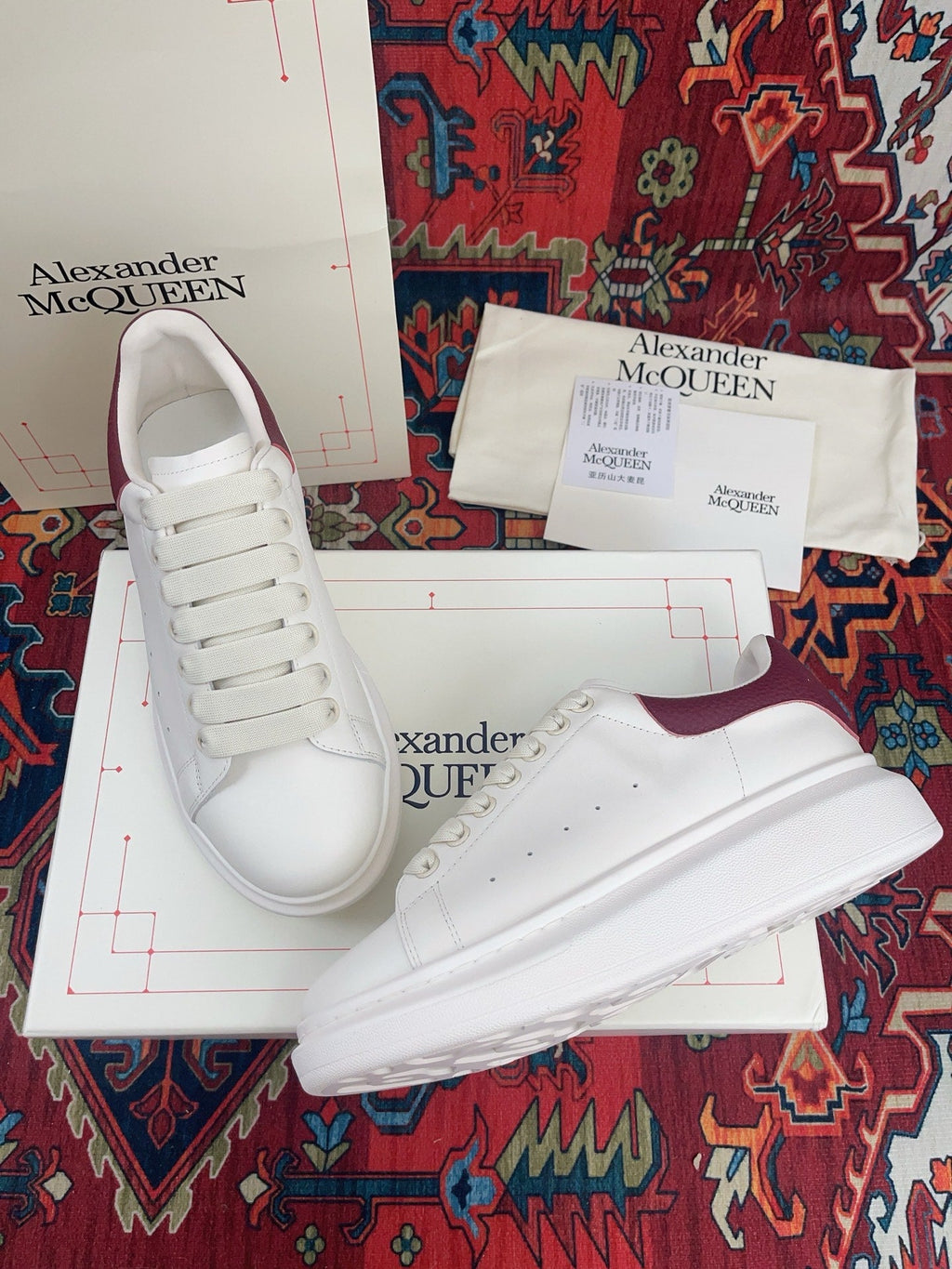OVERSIZED SNEAKER IN WHITE CALFSKIN BURGUNDY EMBOSSED HEEL TAB
