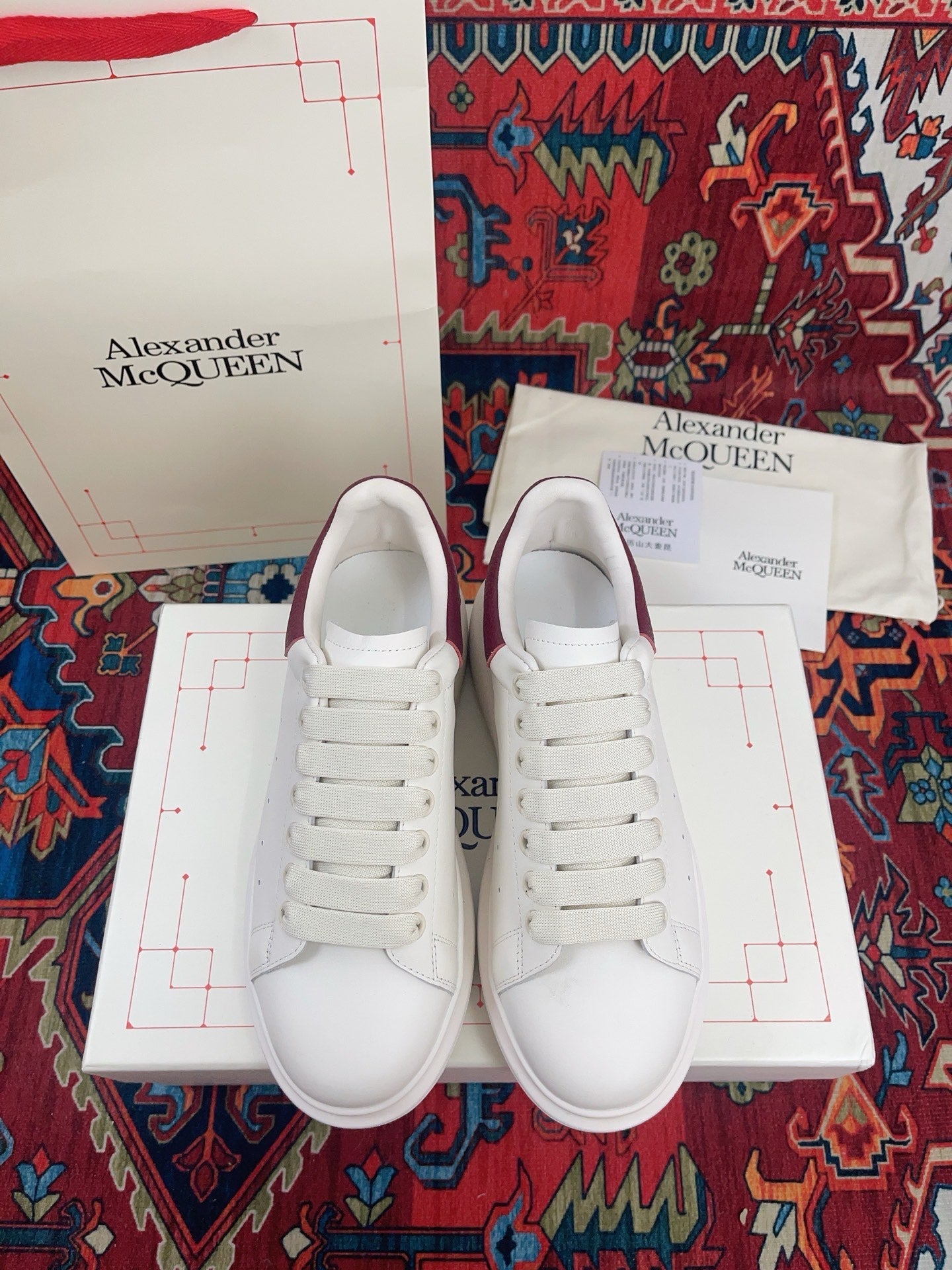 OVERSIZED SNEAKER IN WHITE CALFSKIN BURGUNDY EMBOSSED HEEL TAB