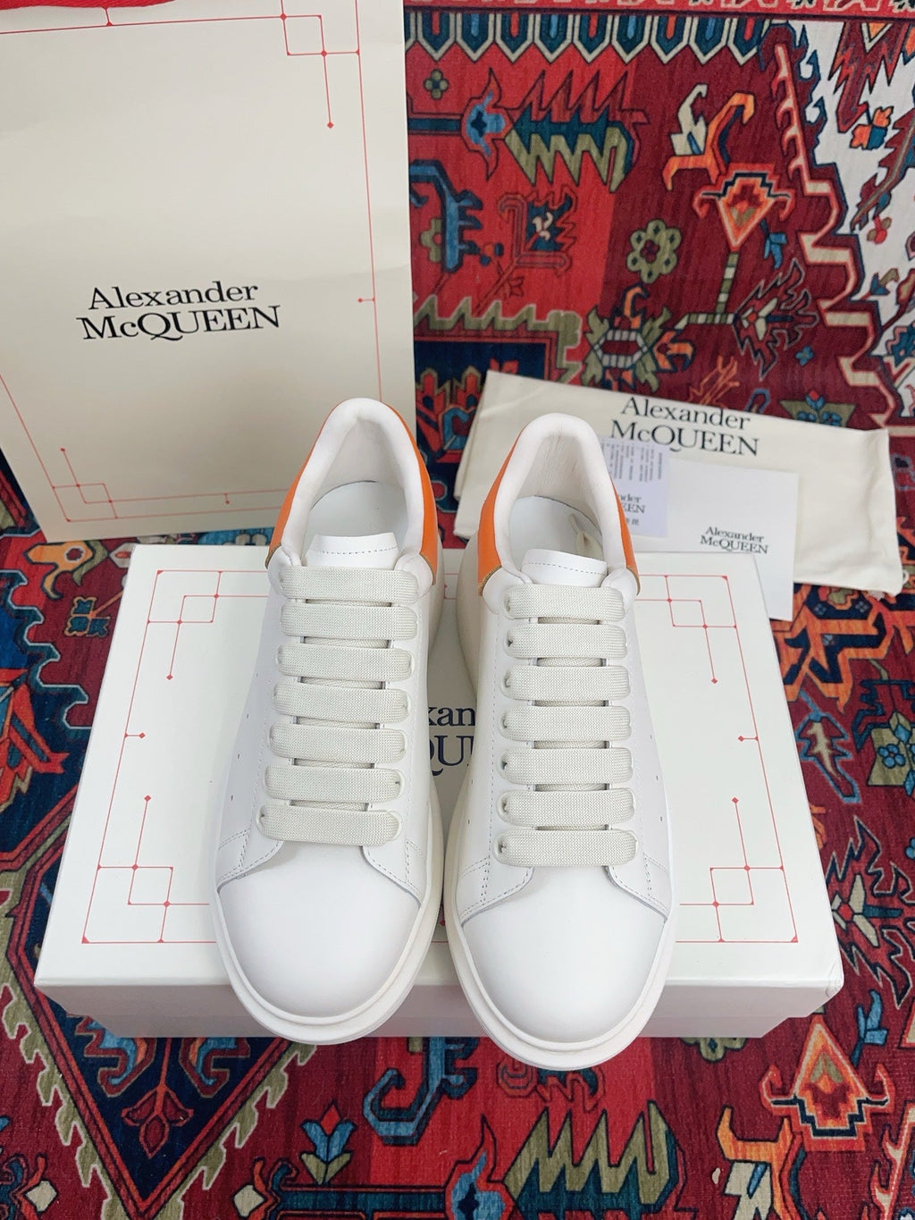 OVERSIZED SNEAKER IN WHITE CALFSKIN ORANGE HEEL TAB EMBOSSED LOGO
