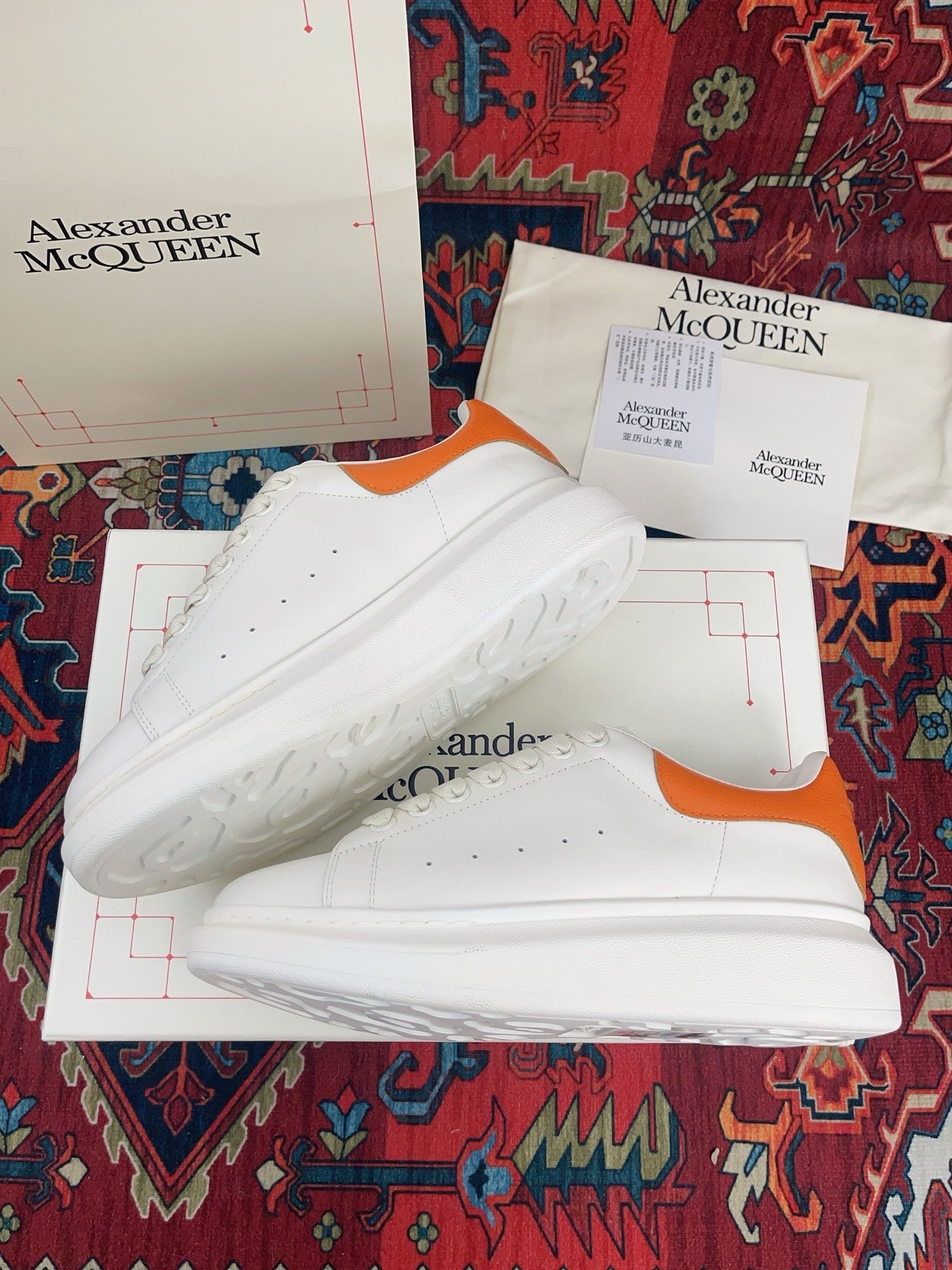 OVERSIZED SNEAKER IN WHITE CALFSKIN ORANGE HEEL TAB EMBOSSED LOGO
