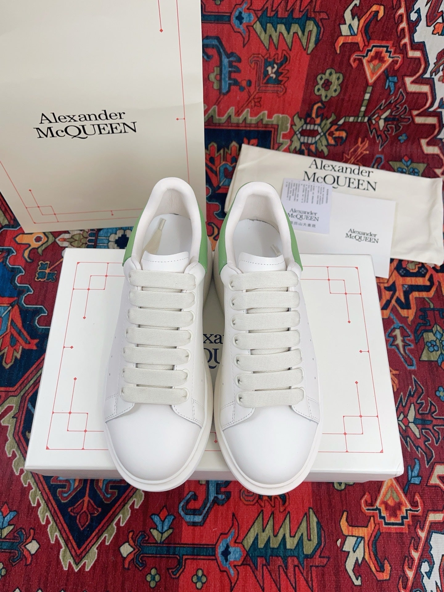 OVERSIZED SNEAKER IN WHITE CALFSKIN WITH EMBOSSED HUNTER GREEN HEEL TAB