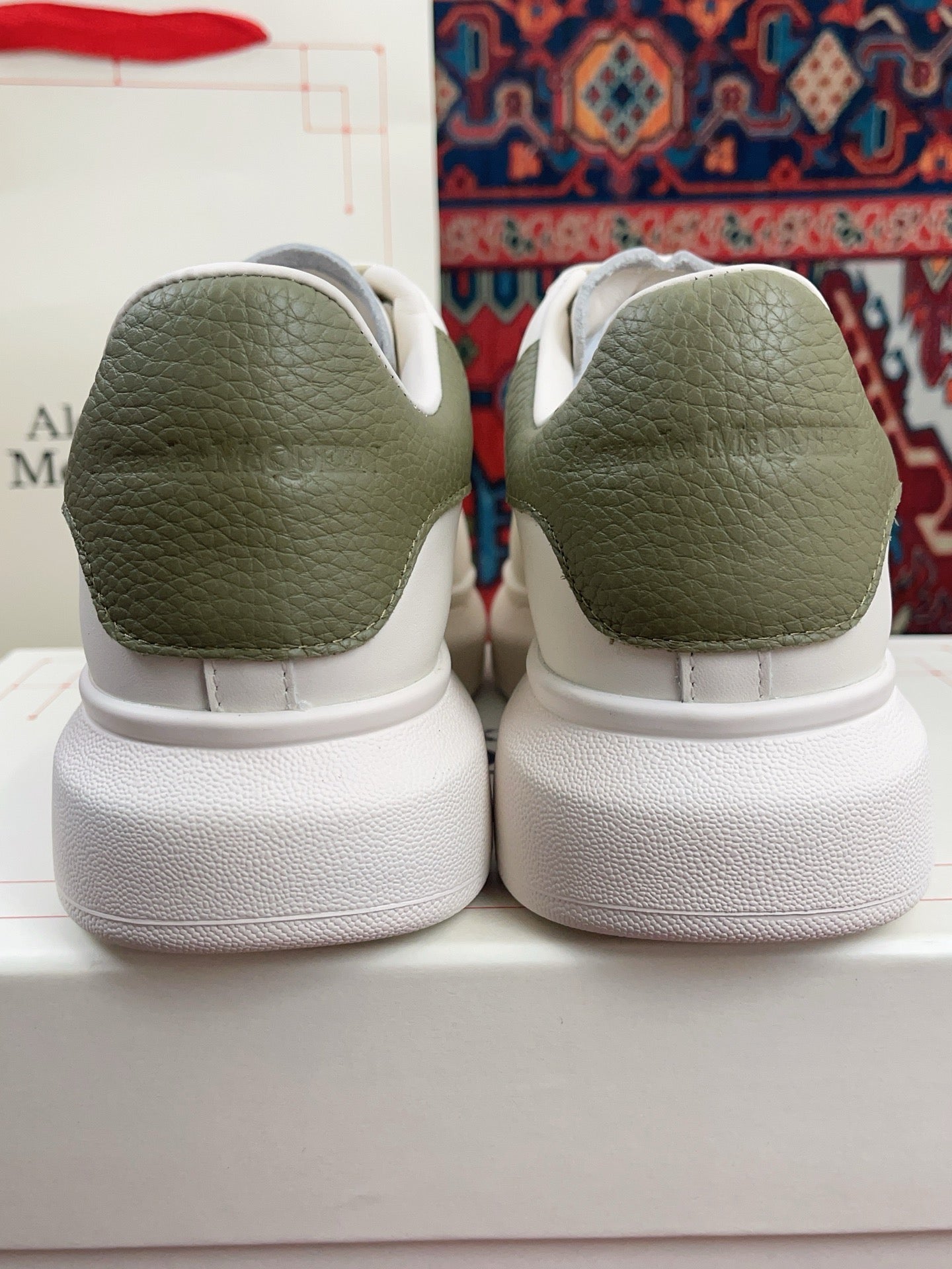 OVERSIZED SNEAKER IN WHITE CALFSKIN WITH EMBOSSED OLIVE GREEN HEEL TAB