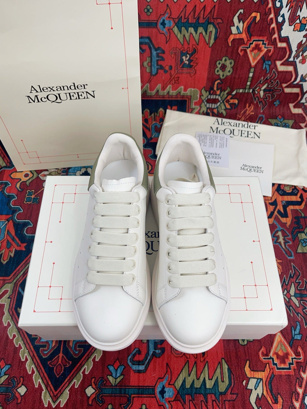 OVERSIZED SNEAKER IN WHITE CALFSKIN WITH EMBOSSED OLIVE GREEN HEEL TAB